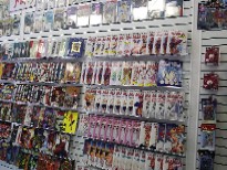 At a recent display and rack show in Las Vegas, NV, Ferrara found slat wall-insertable video racks, which he uses to display trade paperbacks and graphic novels - Click here for a larger image!